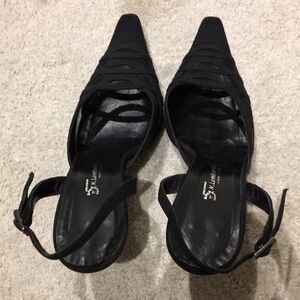 Black low heel sling back sandal.